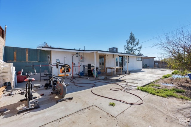 back of property featuring a patio