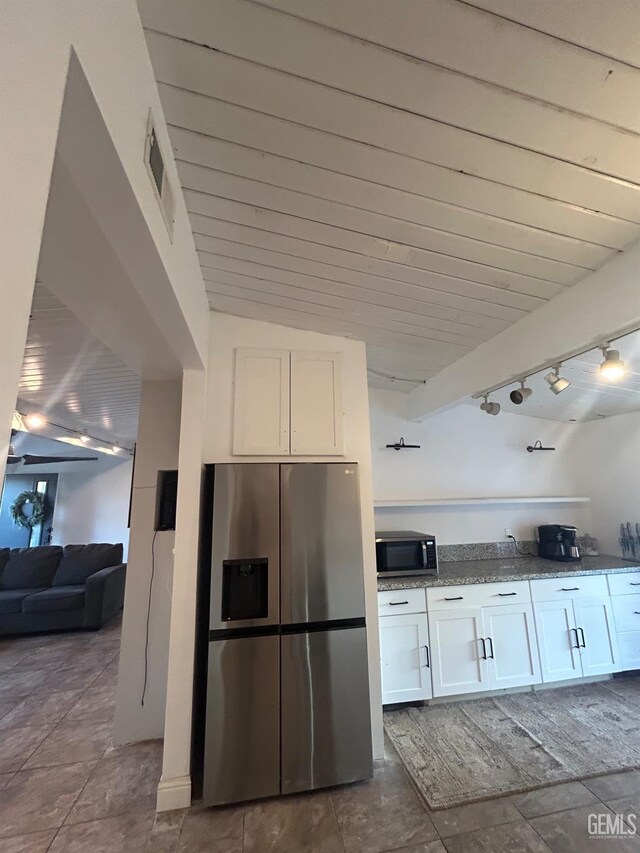 kitchen featuring rail lighting, visible vents, appliances with stainless steel finishes, and white cabinets