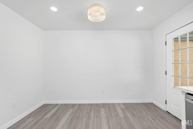 914 4th St, Taft, CA 93268 - spare room with light wood-style flooring, baseboards, a chandelier, and recessed lighting
