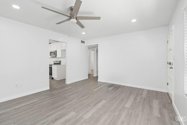 914 4th St, Taft, CA 93268 - unfurnished living room featuring ceiling fan, light wood-style floors, recessed lighting, and baseboards