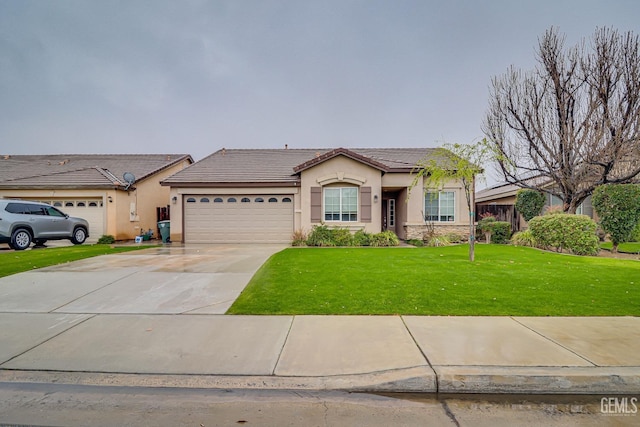 view of front facade with a garage, concrete driveway, a tiled roof, stucco siding, and a front yard