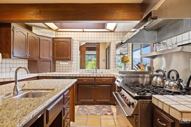 4227 Poso Flat Rd, Bakersfield, CA 93308 - kitchen featuring a sink, decorative backsplash, and plenty of natural light
