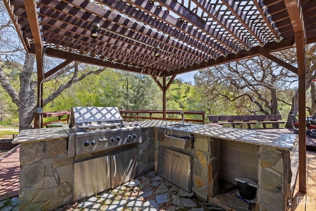 4227 Poso Flat Rd, Bakersfield, CA 93308 - view of patio featuring area for grilling, exterior kitchen, and a pergola