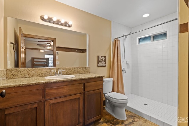4227 Poso Flat Rd, Bakersfield, CA 93308 - bathroom with vanity, ceiling fan, a tile shower, and toilet