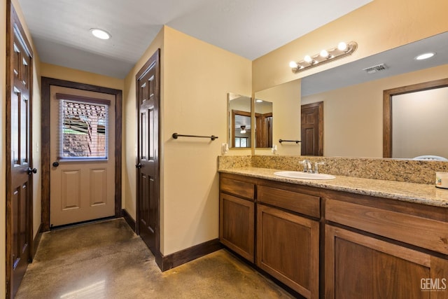 4227 Poso Flat Rd, Bakersfield, CA 93308 - full bath with vanity, recessed lighting, baseboards, finished concrete floors, and visible vents