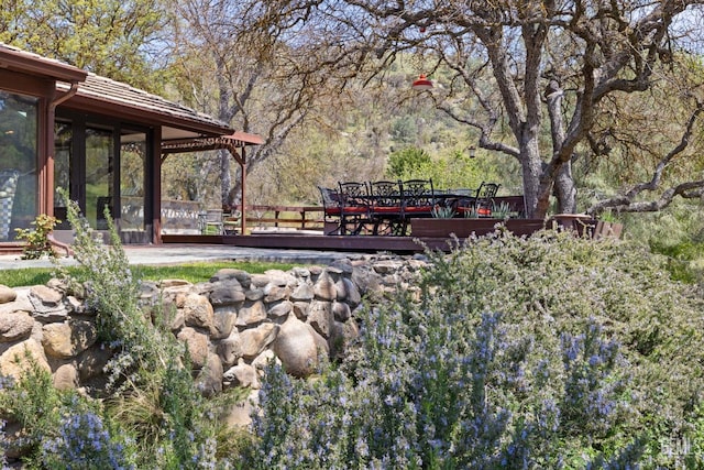 4227 Poso Flat Rd, Bakersfield, CA 93308 - exterior space with a wooden deck and outdoor dining area