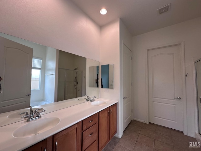 bathroom with tile patterned floors, vanity, and independent shower and bath