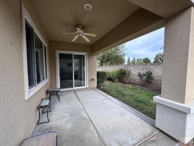 view of patio featuring ceiling fan