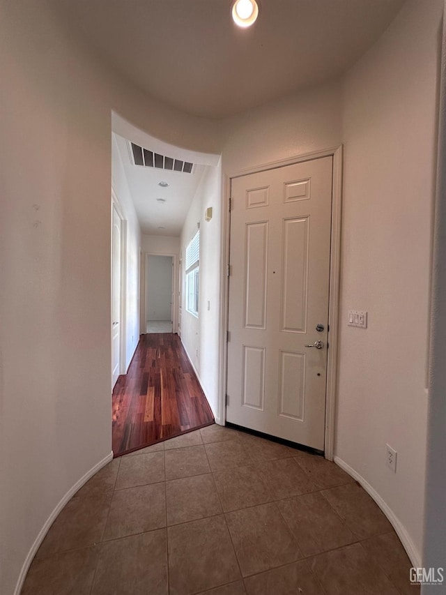 hall featuring tile patterned flooring