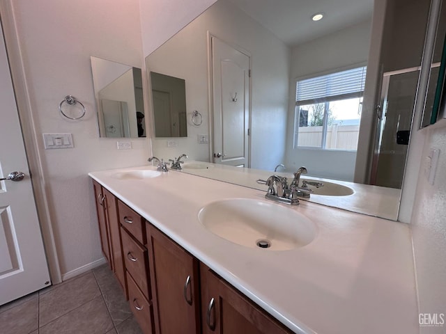 bathroom featuring tile patterned flooring and vanity