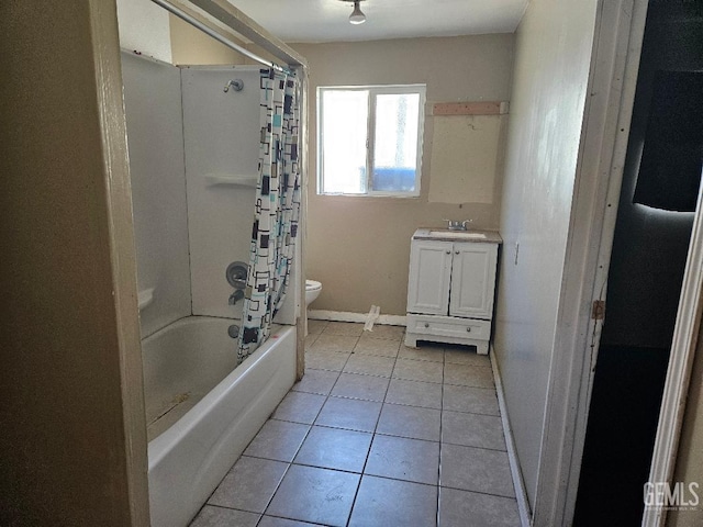 full bathroom with tile patterned floors, vanity, toilet, and shower / bath combo with shower curtain