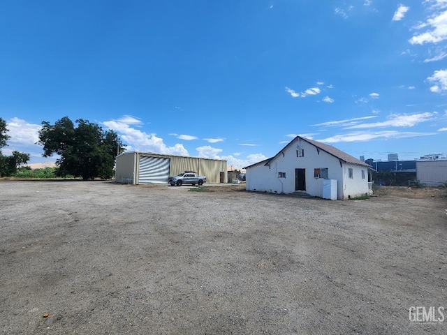 exterior space with an outbuilding and a garage