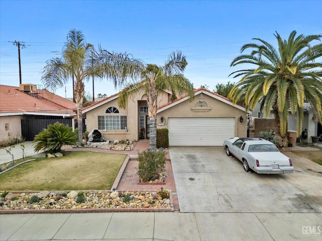 single story home with a garage and a front yard