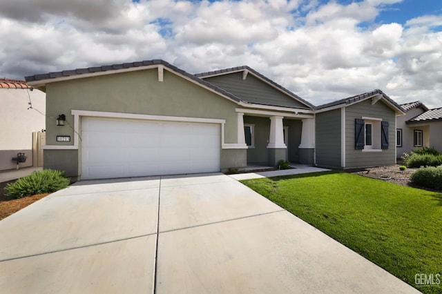 10213 Breitenbush Ave, Bakersfield, CA 93311 - view of front of house featuring a front lawn, an attached garage, driveway, a tile roof, and stucco siding