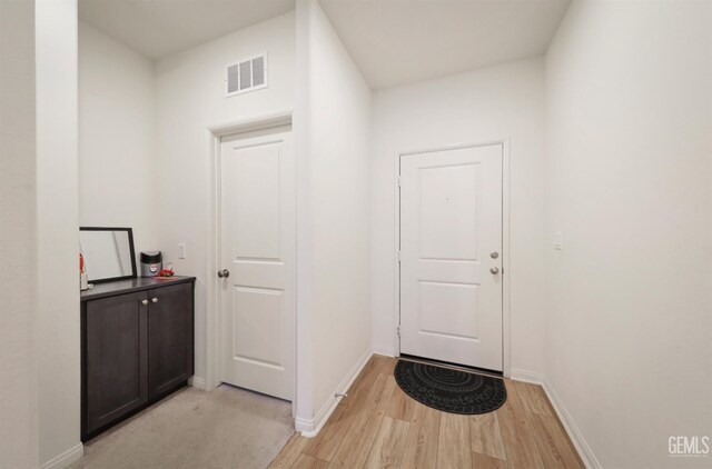 10213 Breitenbush Ave, Bakersfield, CA 93311 - doorway with light wood-type flooring and baseboards