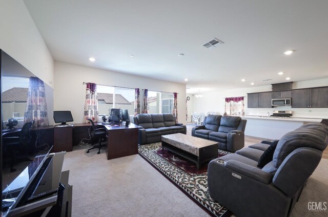 10213 Breitenbush Ave, Bakersfield, CA 93311 - living area featuring a desk, light carpet, and recessed lighting