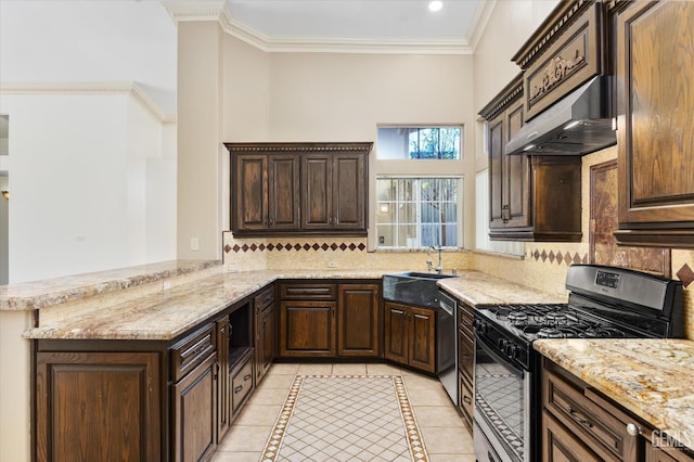 11808 Wethersfield St, Bakersfield, CA 93312 - kitchen with black range with gas stovetop, under cabinet range hood, light tile patterned flooring, dishwasher, and dark brown cabinetry