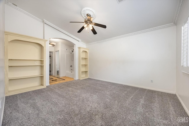 11808 Wethersfield St, Bakersfield, CA 93312 - unfurnished room featuring ceiling fan, carpet flooring, crown molding, arched walkways, and lofted ceiling
