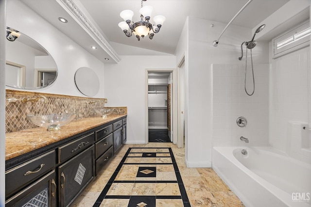11808 Wethersfield St, Bakersfield, CA 93312 - bathroom with inlaid floor details, double vanity, tub / shower combination, recessed lighting, and a chandelier