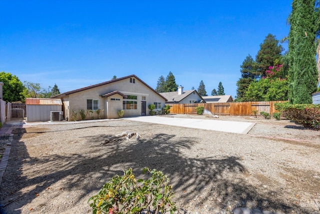 11808 Wethersfield St, Bakersfield, CA 93312 - view of front of house with a fenced backyard, a storage shed, and a patio