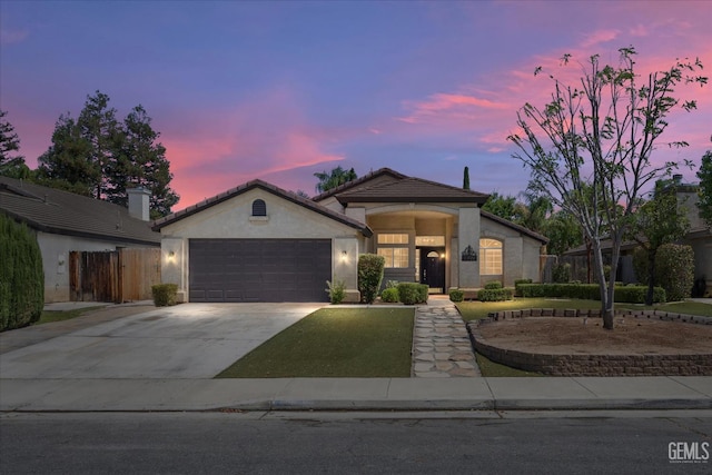 11808 Wethersfield St, Bakersfield, CA 93312 - ranch-style house with a garage, driveway, and stucco siding