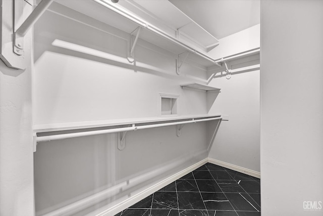11808 Wethersfield St, Bakersfield, CA 93312 - walk in closet featuring dark marble finish floors