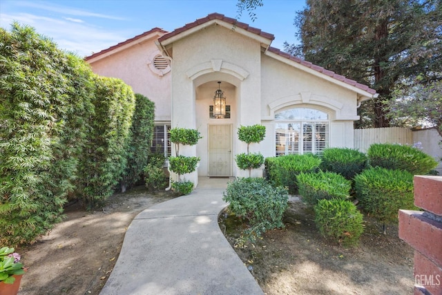 9000 Willamette Ct, Bakersfield, CA 93312 - view of front of house with stucco siding and a tile roof