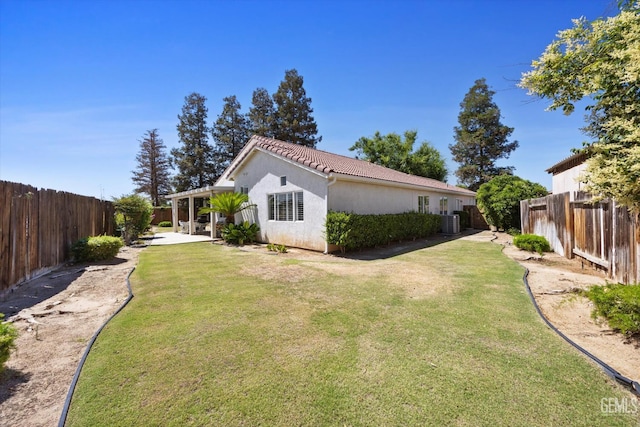 9000 Willamette Ct, Bakersfield, CA 93312 - view of home's exterior featuring stucco siding, a fenced backyard, a patio, and a tile roof
