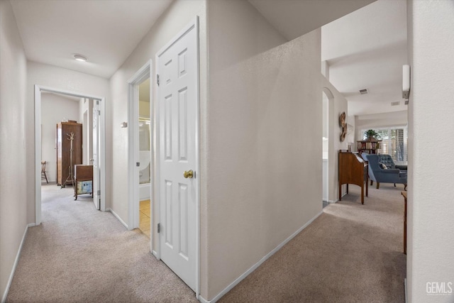 9000 Willamette Ct, Bakersfield, CA 93312 - hallway with light carpet and arched walkways