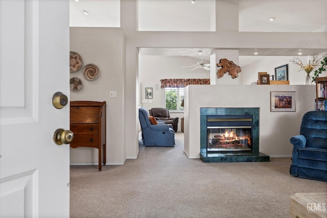 9000 Willamette Ct, Bakersfield, CA 93312 - living room with carpet, a tile fireplace, and a ceiling fan
