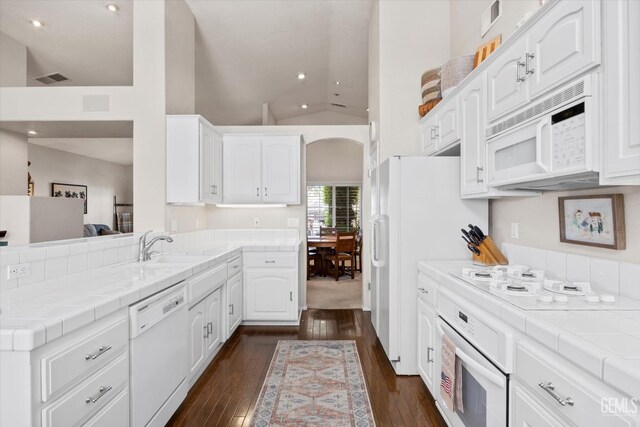 9000 Willamette Ct, Bakersfield, CA 93312 - kitchen featuring white appliances, dark wood-style flooring, tile countertops, white cabinets, and recessed lighting