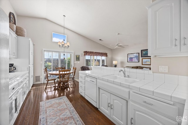 9000 Willamette Ct, Bakersfield, CA 93312 - kitchen with dishwasher, a peninsula, open floor plan, white cabinets, and dark wood-style flooring