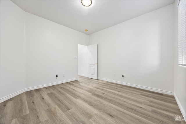 spare room featuring light hardwood / wood-style flooring