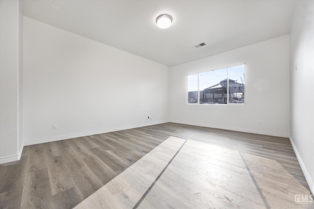 unfurnished room featuring light hardwood / wood-style flooring