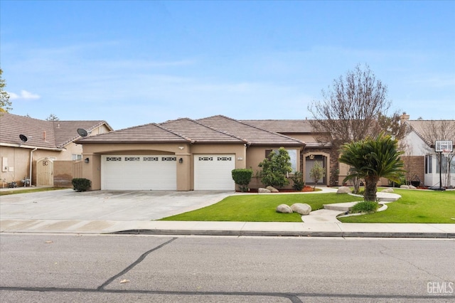 view of front of house featuring a front lawn and a garage