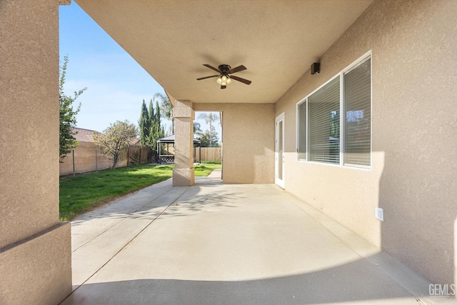 view of patio with ceiling fan and a gazebo