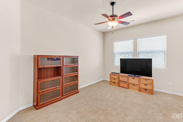 living room with carpet floors, baseboards, ceiling fan, and visible vents