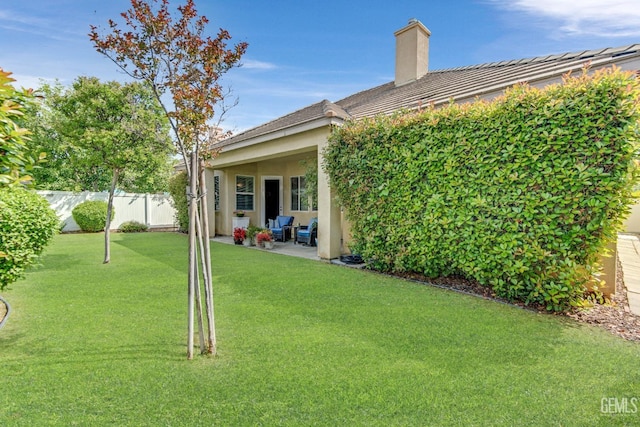 view of yard featuring a patio area and fence