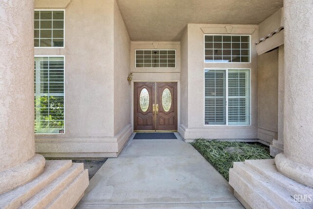 10611 Fishers Peak Dr, Bakersfield, CA 93312 - doorway to property with stucco siding