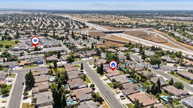 10611 Fishers Peak Dr, Bakersfield, CA 93312 - aerial view of property's location featuring nearby suburban area and a mountain backdrop