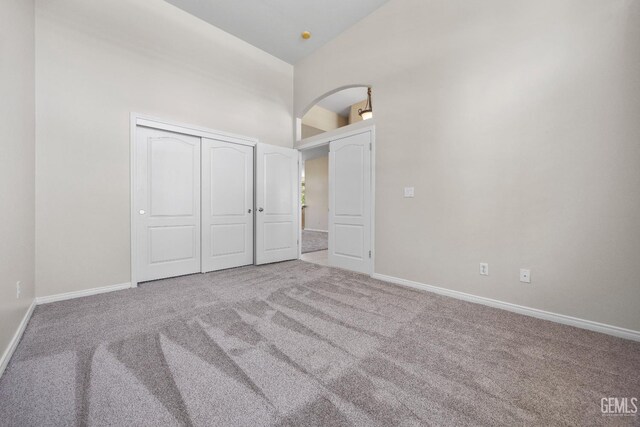 10611 Fishers Peak Dr, Bakersfield, CA 93312 - unfurnished bedroom with carpet, high vaulted ceiling, and a closet