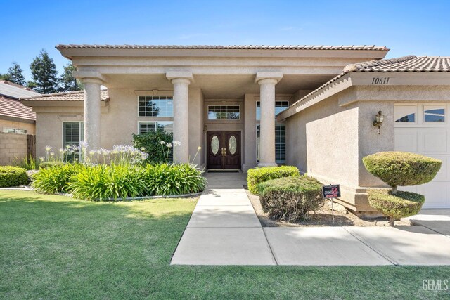 10611 Fishers Peak Dr, Bakersfield, CA 93312 - entrance to property featuring an attached garage, stucco siding, and a lawn