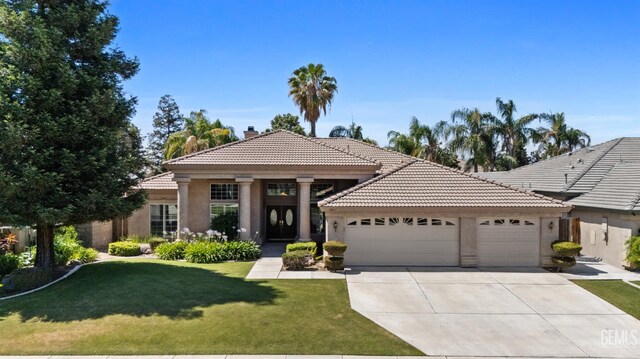 10611 Fishers Peak Dr, Bakersfield, CA 93312 - view of front of house with a tile roof, an attached garage, stucco siding, a chimney, and driveway