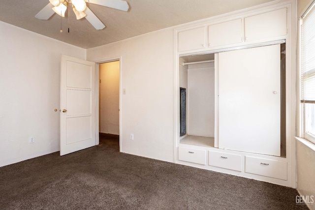 unfurnished bedroom with carpet, ceiling fan, and a closet