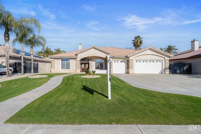 view of front of house with a garage and a front yard