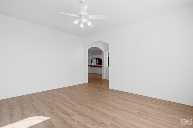 unfurnished room featuring ceiling fan and light wood-type flooring