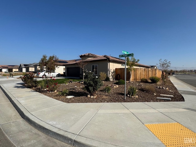 ranch-style house featuring a garage