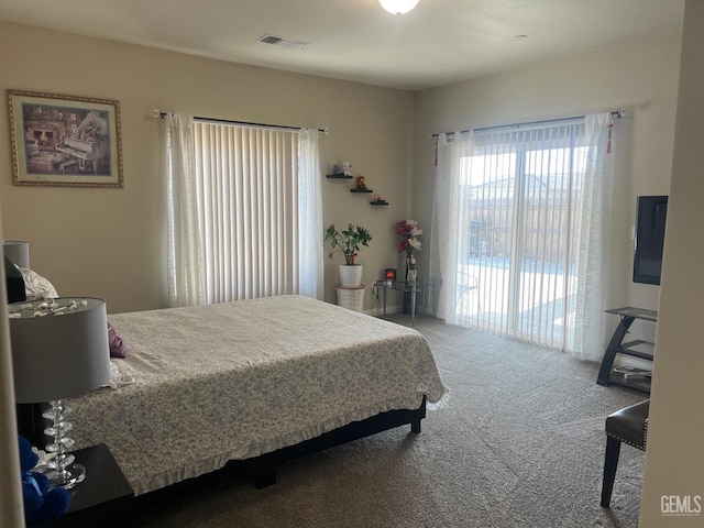 bedroom featuring carpet floors and access to outside