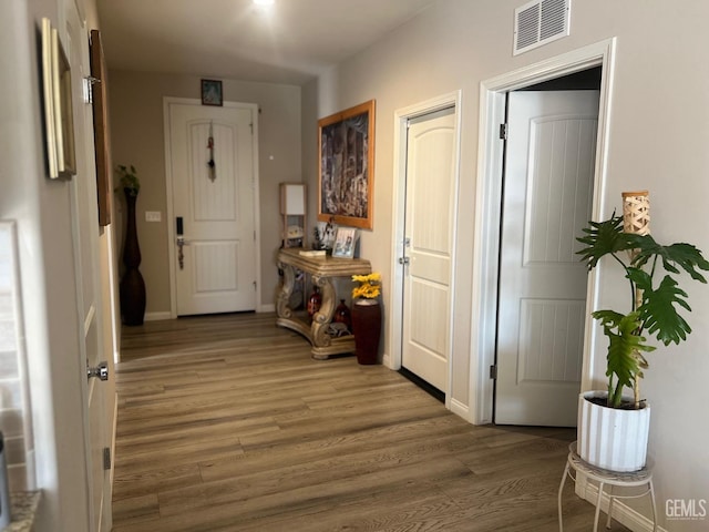 corridor featuring hardwood / wood-style floors