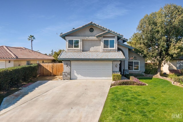 front of property featuring a garage and a front yard